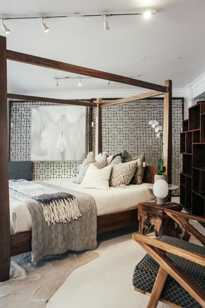 pexels-photo-5531710-5531710 Stylish and cozy bedroom with modern interior design featuring a four-poster bed and wooden furniture.