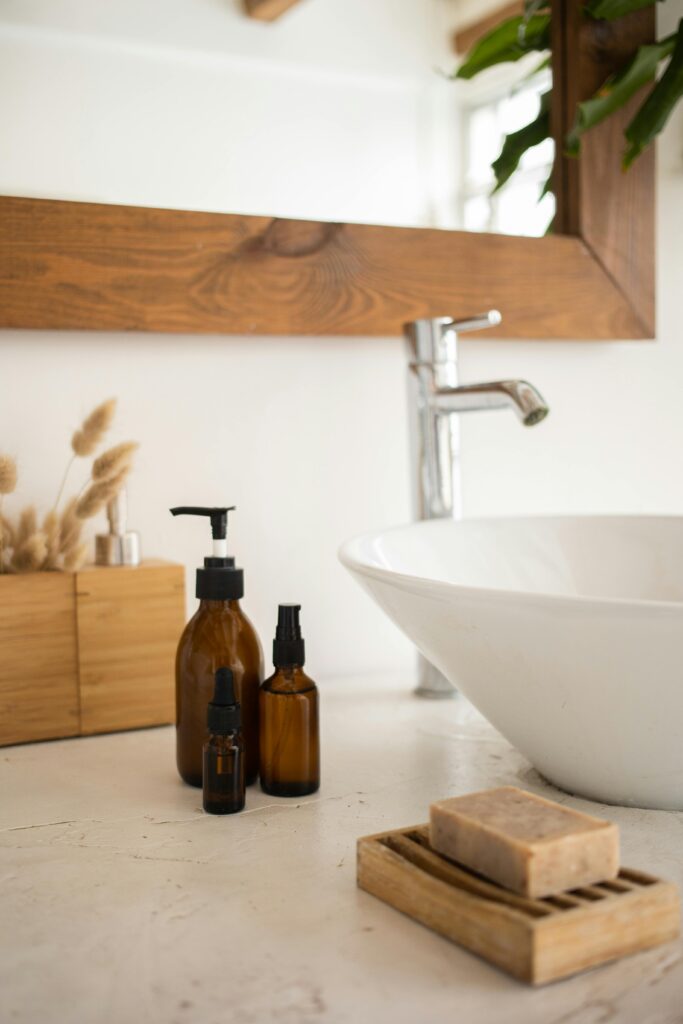 pexels-photo-6781117-6781117 A serene bathroom scene featuring skincare products, a soap dish, and a stylish basin.